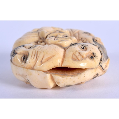 400 - A JAPANESE CARVED BONE NETSUKE. 25 grams. 4 cm x 3.5 cm.