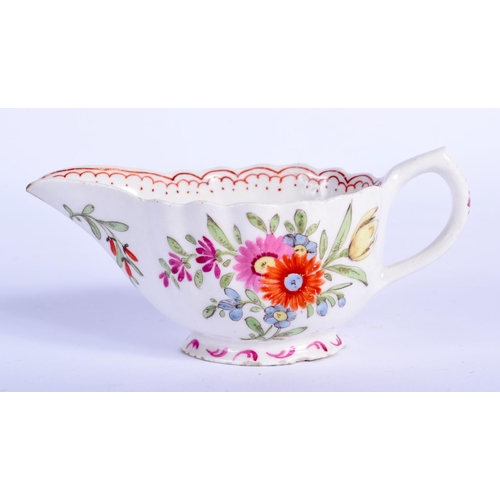 66 - AN 18TH CENTURY BOW PORCELAIN FAMILLE ROSE FLUTED CREAM BOAT painted with flowers. 10.5 cm wide.