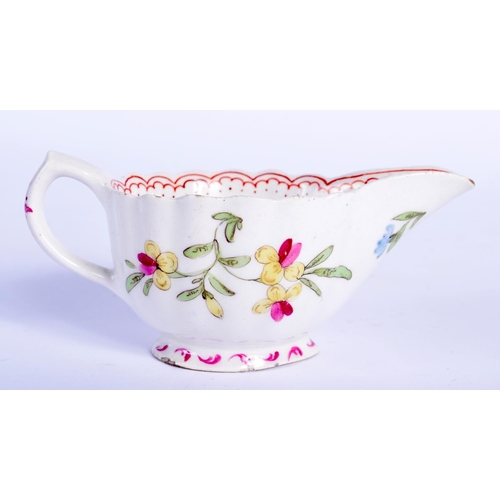 66 - AN 18TH CENTURY BOW PORCELAIN FAMILLE ROSE FLUTED CREAM BOAT painted with flowers. 10.5 cm wide.