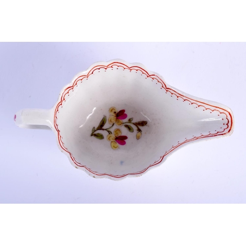 66 - AN 18TH CENTURY BOW PORCELAIN FAMILLE ROSE FLUTED CREAM BOAT painted with flowers. 10.5 cm wide.