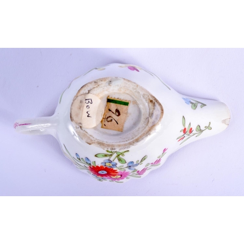 66 - AN 18TH CENTURY BOW PORCELAIN FAMILLE ROSE FLUTED CREAM BOAT painted with flowers. 10.5 cm wide.