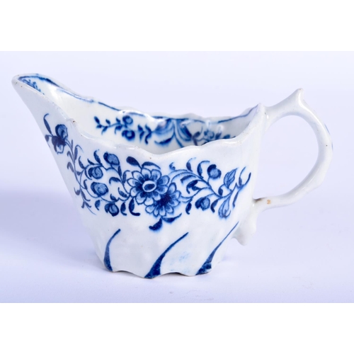 67 - AN 18TH CENTURY ENGLISH BLUE AND WHITE FLUTED CREAM BOAT Probably Derby, painted with floral sprays.... 