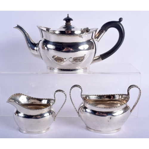 680 - A THREE PIECE 1920S SILVER TEASET. London 1924. 592 grams. 25 cm x 11 cm. (3)