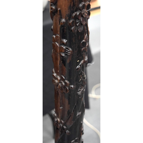 681 - A 19TH CENTURY CHINESE CARVED FLOOR LAMP, decorated with prunus and foliage. 200 cm