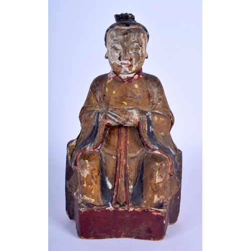 70 - AN 18TH CENTURY CHINESE POLYCHROMED WOOD TEMPLE FIGURE Ming style, modelled clutching an offering ve... 
