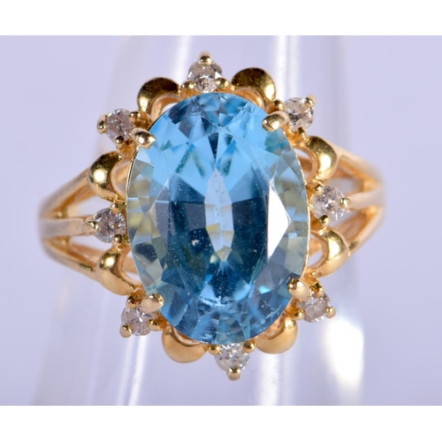 702 - AN 18CT GOLD DIAMOND AND AQUAMARINE RING. 5.8 grams. L/M.