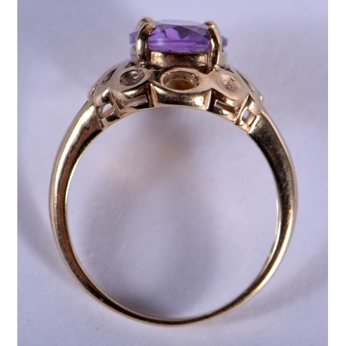 707 - A 9CT GOLD AND AMETHYST RING. 3.7 grams. N.