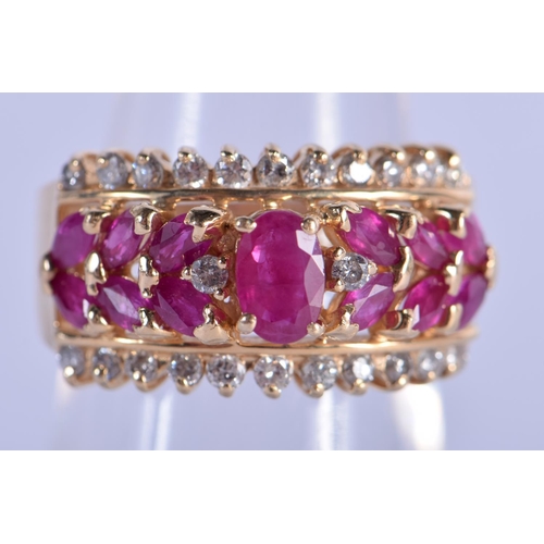 709 - A 14CT GOLD DIAMOND AND RUBY RING. 6.9 grams. N.