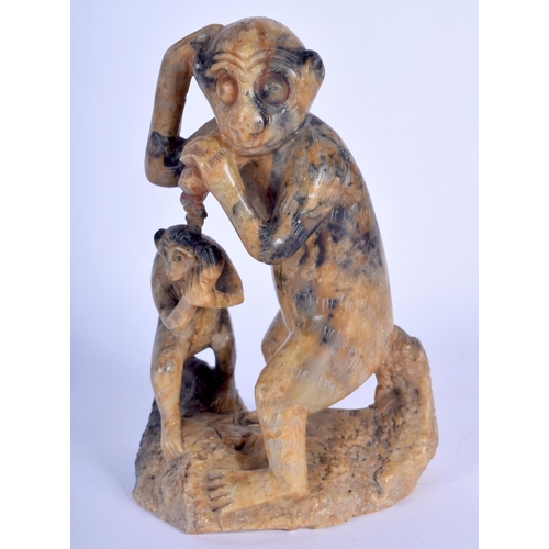 71 - A 1930S CHINESE CARVED SOAPSTONE FIGURE OF A MONKEY modelled with its young. 15 cm x 8 cm.