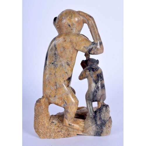 71 - A 1930S CHINESE CARVED SOAPSTONE FIGURE OF A MONKEY modelled with its young. 15 cm x 8 cm.