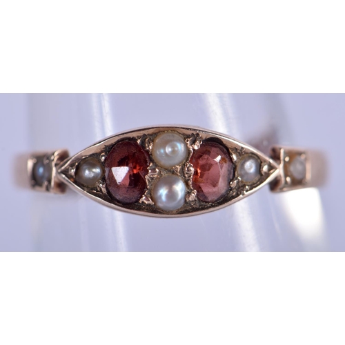 711 - A 9CT GOLD PEARL AND RUBY RING. 1.3 grams. N.