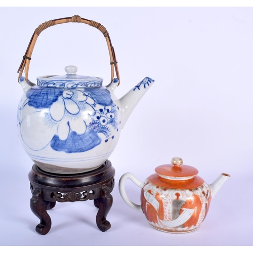 72 - TWO EARLY 20TH CENTURY JAPANESE MEIJI PERIOD TEAPOTS AND COVERS together with a stand. Largest 20 cm... 