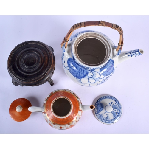 72 - TWO EARLY 20TH CENTURY JAPANESE MEIJI PERIOD TEAPOTS AND COVERS together with a stand. Largest 20 cm... 