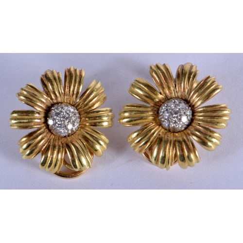 725 - A PAIR OF 18CT GOLD AND DIAMOND FLOWER EARRINGS. 10.2 grams. 2 cm wide.