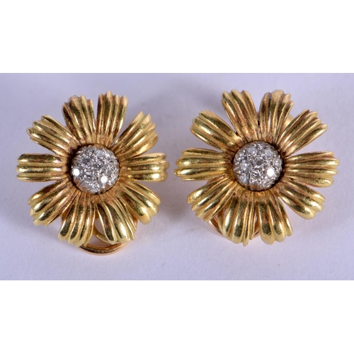 725 - A PAIR OF 18CT GOLD AND DIAMOND FLOWER EARRINGS. 10.2 grams. 2 cm wide.