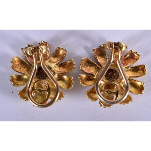 725 - A PAIR OF 18CT GOLD AND DIAMOND FLOWER EARRINGS. 10.2 grams. 2 cm wide.