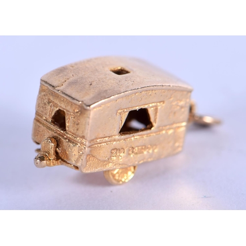 727 - A 9CT GOLD CARAVAN CHARM. 3.3 grams. 1.75 cm x 1 cm.