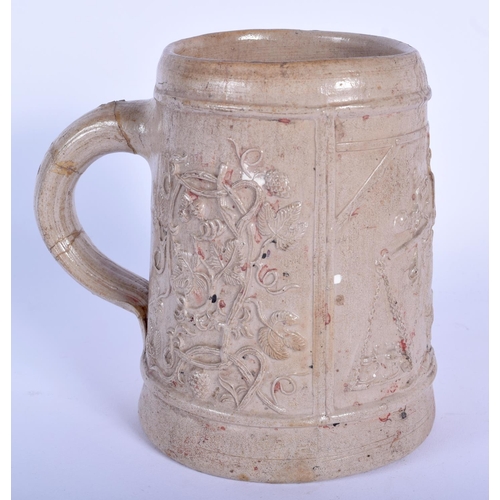 74 - AN EARLY RHINELAND STONEWARE SALT GLAZED TANKARD probably 17th/18th century, decorated with a trader... 