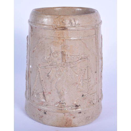 74 - AN EARLY RHINELAND STONEWARE SALT GLAZED TANKARD probably 17th/18th century, decorated with a trader... 
