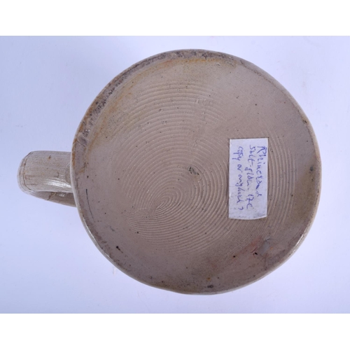 74 - AN EARLY RHINELAND STONEWARE SALT GLAZED TANKARD probably 17th/18th century, decorated with a trader... 