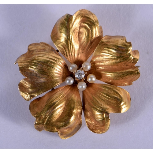 742 - A GOLD DIAMOND AND PEARL FLOWER BROOCH. 3 grams. 2.5 cm wide.