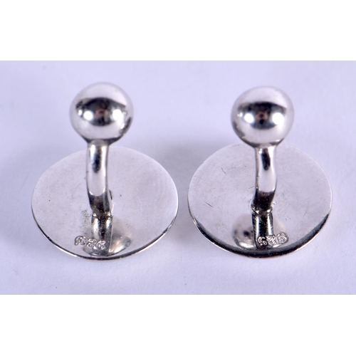 752 - A PAIR OF SILVER AND ENAMEL CUFFLINKS. 13 grams. 1.75 cm x 1.5 cm.