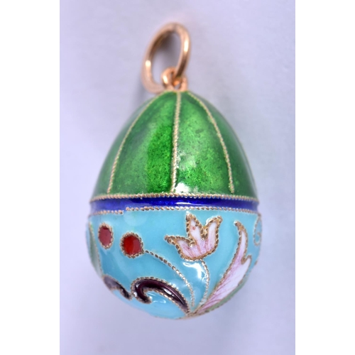 756 - A CONTINENTAL SILVER AND ENAMEL EGG PENDANT. 6.2 grams. 2.5 cm x 1.75 cm.