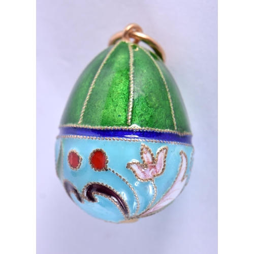 756 - A CONTINENTAL SILVER AND ENAMEL EGG PENDANT. 6.2 grams. 2.5 cm x 1.75 cm.