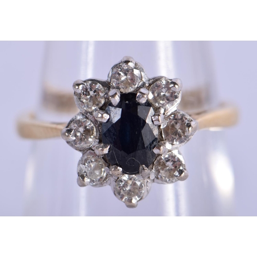 762 - AN 18CT GOLD DIAMOND AND SAPPHIRE RING. 4 grams. M.