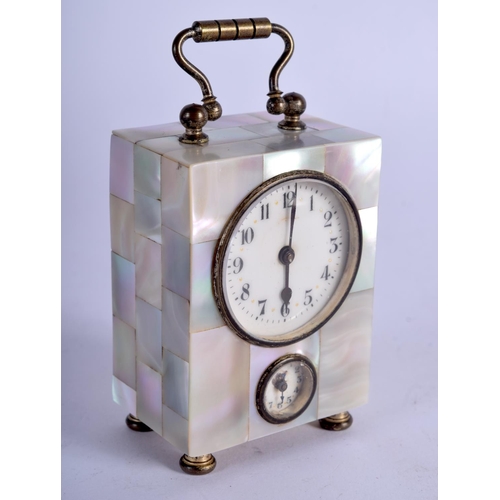 778 - AN ANTIQUE FRENCH MOTHER OF PEARL MINIATURE CARRIAGE CLOCK. 8.5 cm high inc handle.