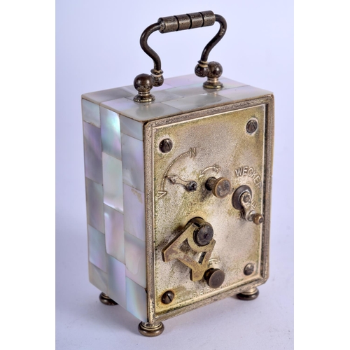 778 - AN ANTIQUE FRENCH MOTHER OF PEARL MINIATURE CARRIAGE CLOCK. 8.5 cm high inc handle.