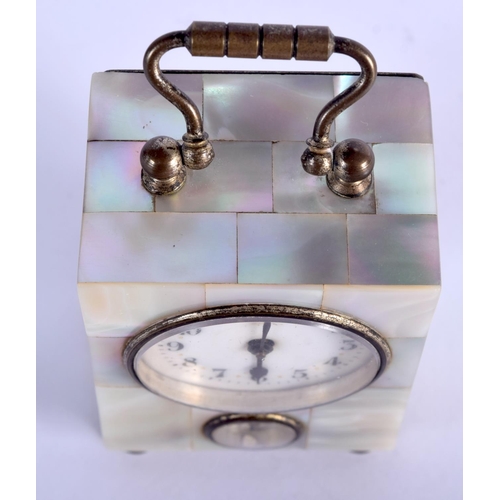 778 - AN ANTIQUE FRENCH MOTHER OF PEARL MINIATURE CARRIAGE CLOCK. 8.5 cm high inc handle.