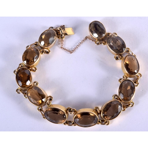 781 - A 9CT GOLD AND CITRINE BRACELET. 22 grams. 18.5 cm long.