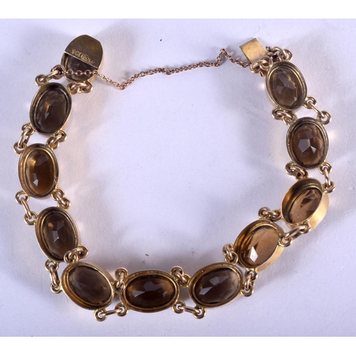 781 - A 9CT GOLD AND CITRINE BRACELET. 22 grams. 18.5 cm long.