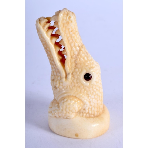 792 - A JAPANESE BONE CROCODILE. 61 grams. 6.75 cm x 3.5 cm.