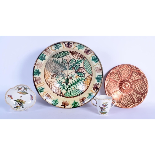 82 - A LARGE CONTINENTAL MAJOLICA TYPE GLAZED CIRCULAR POTTERY BOWL together with a Hispano moresque plat... 