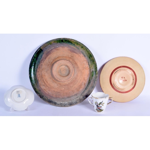 82 - A LARGE CONTINENTAL MAJOLICA TYPE GLAZED CIRCULAR POTTERY BOWL together with a Hispano moresque plat... 