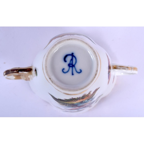 82 - A LARGE CONTINENTAL MAJOLICA TYPE GLAZED CIRCULAR POTTERY BOWL together with a Hispano moresque plat... 