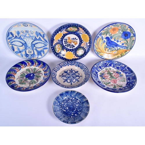 83 - SEVEN LARGE STYLISH SPANISH POTTERY DISHES modelled in the 17th/18th century style. Largest 27 cm di... 