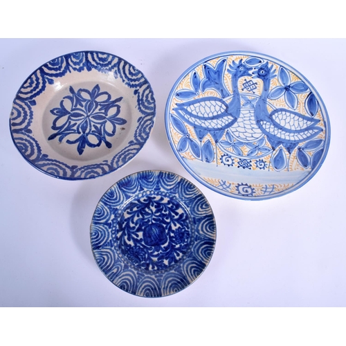 83 - SEVEN LARGE STYLISH SPANISH POTTERY DISHES modelled in the 17th/18th century style. Largest 27 cm di... 
