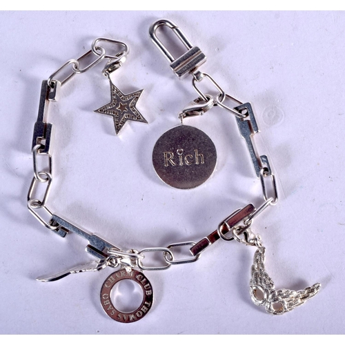 844 - A SILVER CHARM BRACELET. 25 grams. 24 cm long.