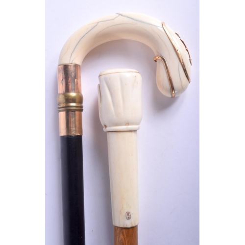 865 - A VICTORIAN GOLD OVERLAID IVORY WALKING CANE together with a carved bone handled cane. Largest 84 cm... 