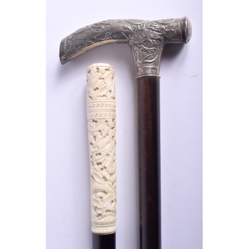 868 - A 19TH CENTURY CHINESE EXPORT SILVER HANDLED WALKING CANE together with a Canton ivory walking cane.... 