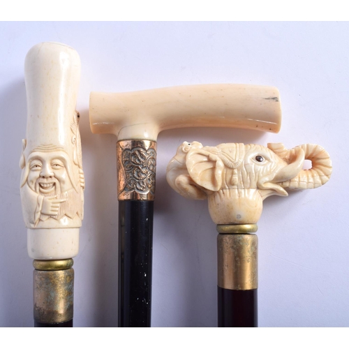 873 - AN ANTIQUE IVORY HANDLED WALKING CANE together with two other novelty canes. Largest 90 cm long. (3)