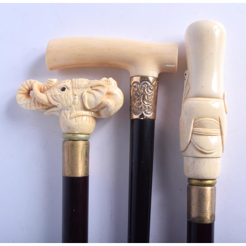 873 - AN ANTIQUE IVORY HANDLED WALKING CANE together with two other novelty canes. Largest 90 cm long. (3)