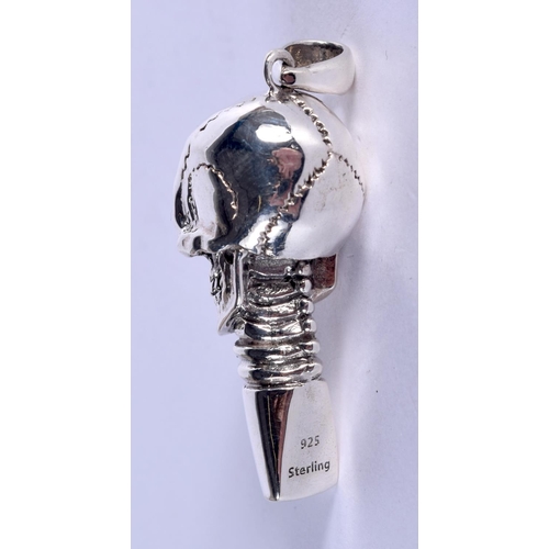 884 - A SILVER AND RUBY SKULL WHISTLE. 17 grams. 5 cm x 1.5 cm.