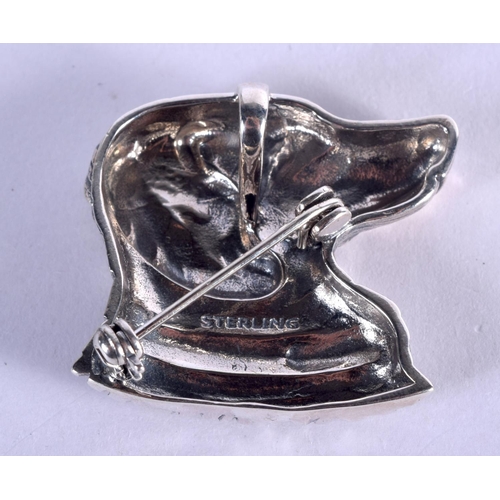 894 - A SILVER DOG BROOCH. 11 grams. 2.75 cm x 3 cm.