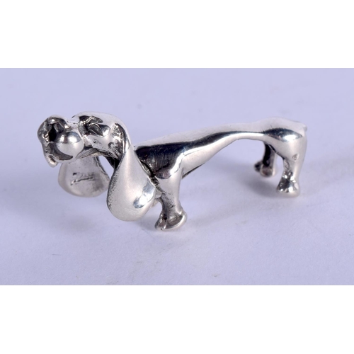 898 - A SILVER SAUSAGE DOG. 3.8 grams. 2.75 cm x 1.5 cm.