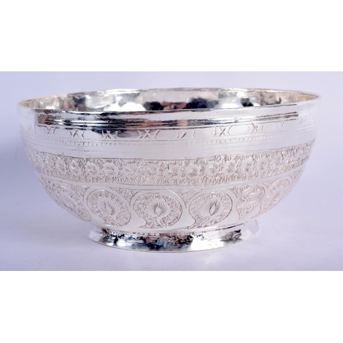 902 - AN INDIAN WHITE METAL BOWL WITH EMBOSSED DECORATION.  7.5cm diameter, 17cm high, weight 468g