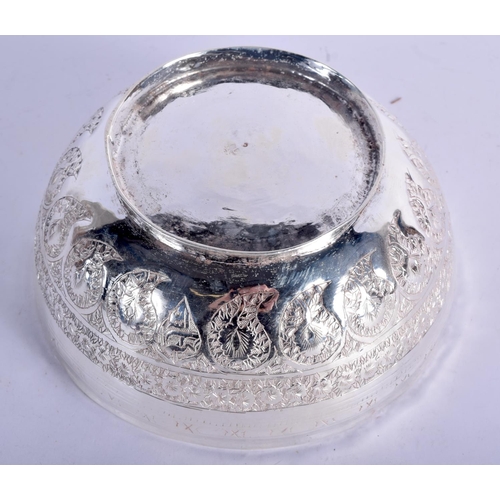 902 - AN INDIAN WHITE METAL BOWL WITH EMBOSSED DECORATION.  7.5cm diameter, 17cm high, weight 468g